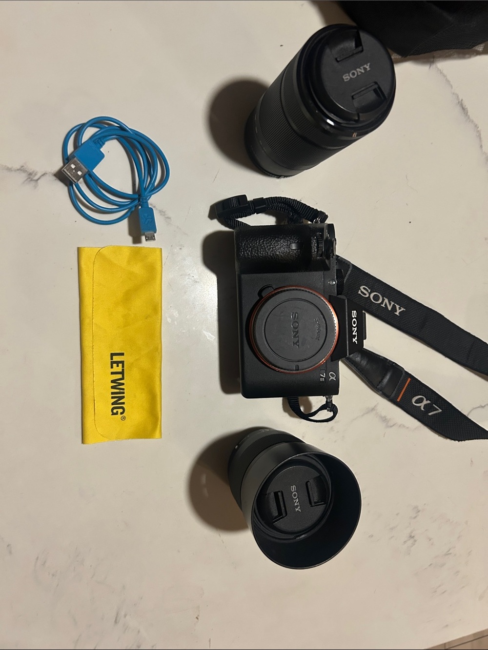 Sony Alpha a7 II Mirrorless Camera Body with Black Straps and Lenses